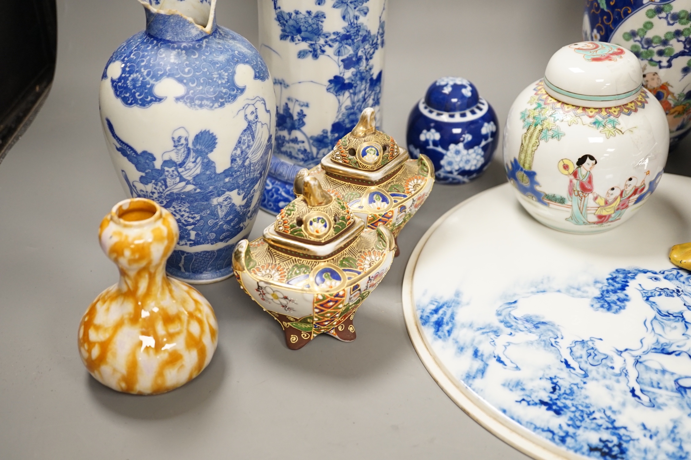 A group of 20th century Chinese and Japanese ceramics, including a blue and white circular plaque, 31 cm diameter